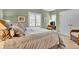 Cozy bedroom with soft green walls, shuttered windows, and comfortable furnishings at 100 S University Blvd # 4, Denver, CO 80209