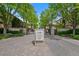 Exclusive community entrance with gated access and stone signage at 100 South University Private Drive at 100 S University Blvd # 4, Denver, CO 80209