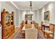 Formal dining room featuring hardwood floors, a large wooden table, decorative lighting, and classic decor at 100 S University Blvd # 4, Denver, CO 80209