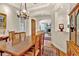 Elegant dining room with hardwood floors that lead to a living area with a cozy fireplace and arched doorways at 100 S University Blvd # 4, Denver, CO 80209
