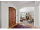 Welcoming entryway with grand wooden door leading to the spacious living room at 100 S University Blvd # 4, Denver, CO 80209