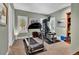 Home gym with treadmill, weight machine, and bright windows offering a private space for fitness at 100 S University Blvd # 4, Denver, CO 80209