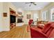 Comfortable living room featuring a corner fireplace, built-in shelving, and stylish decor for a cozy atmosphere at 100 S University Blvd # 4, Denver, CO 80209