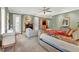 Comfortable bedroom with a sitting area, fireplace, built-in cabinet, doors to the backyard at 100 S University Blvd # 4, Denver, CO 80209