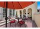 Charming patio area with outdoor seating, a stylish umbrella and decorative landscaping at 100 S University Blvd # 4, Denver, CO 80209