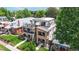 Aerial view of a modern home with multiple balconies and landscaped yard in a residential neighborhood at 1426 S Pearl St, Denver, CO 80210
