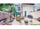 A backyard patio featuring a seating area, a grill, and landscaped surroundings at 1426 S Pearl St, Denver, CO 80210