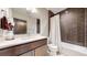 Modern bathroom featuring a stylish vanity, sleek fixtures, and a tiled shower-tub combination at 1426 S Pearl St, Denver, CO 80210