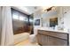 Modern bathroom boasting a large vanity, sleek tile work, and abundant natural light at 1426 S Pearl St, Denver, CO 80210