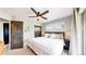 Comfortable bedroom featuring wood-look doors, a ceiling fan, and a window with blinds at 1426 S Pearl St, Denver, CO 80210