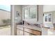 Inviting coffee bar with ample counter space, wood cabinets and bright windows that look out to the backyard at 1426 S Pearl St, Denver, CO 80210