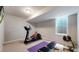 Dedicated exercise room equipped with an elliptical machine, weights, and fitness accessories at 1426 S Pearl St, Denver, CO 80210