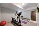 Home exercise area featuring an elliptical, weight bench, and free weights for convenient workouts at 1426 S Pearl St, Denver, CO 80210