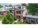 Modern home featuring multiple balconies, landscaped yard, and unique architectural details at 1426 S Pearl St, Denver, CO 80210