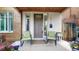 Inviting front porch with seating, decorative planters, and clear address numbers at 1426 S Pearl St, Denver, CO 80210