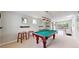 Bright game room featuring a billiards table and a view of the outside at 1426 S Pearl St, Denver, CO 80210
