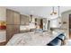 Spacious kitchen with granite countertops, stainless steel appliances, and modern lighting at 1426 S Pearl St, Denver, CO 80210