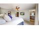 Well-lit main bedroom with plush pillows, ceiling fan, lots of natural light and access to the bathroom at 1426 S Pearl St, Denver, CO 80210