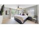 Comfortable main bedroom with natural light, ceiling fan, plush pillows and access to an outdoor area at 1426 S Pearl St, Denver, CO 80210