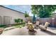 A spacious backyard patio with ample seating, potted plants, and a well-manicured garden at 1426 S Pearl St, Denver, CO 80210