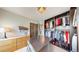 Stylish walk-in closet featuring custom organizers, drawers, and a modern lighting fixture at 1426 S Pearl St, Denver, CO 80210