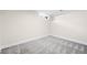 Basement bedroom featuring neutral paint, patterned carpet and natural light from the window at 1469 S Lincoln St, Denver, CO 80210