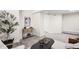 Basement living area features neutral paint, carpet, and stylish decor at 1469 S Lincoln St, Denver, CO 80210