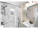 Bathroom with marble shower, marble floors, and modern bronze fixtures at 1469 S Lincoln St, Denver, CO 80210