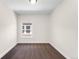 Cozy bedroom featuring neutral walls, plush carpet, and a window with natural light at 1469 S Lincoln St, Denver, CO 80210