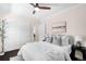 Bedroom with large closet, neutral colors, a ceiling fan, and an ensuite bathroom at 1469 S Lincoln St, Denver, CO 80210