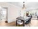 Dining room with table and seating, with doorways to a half bath and the living room at 1469 S Lincoln St, Denver, CO 80210