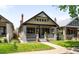 Charming home with lush front yard, inviting porch, and beautiful curb appeal at 1469 S Lincoln St, Denver, CO 80210