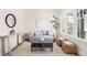 Cozy living room with a comfortable sofa, stylish decor, and abundant natural light at 1469 S Lincoln St, Denver, CO 80210