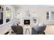 Inviting living room with fireplace, large windows, and comfortable seating at 1469 S Lincoln St, Denver, CO 80210