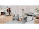 Open-concept living area featuring modern furniture, hardwood flooring, and seamless flow at 1469 S Lincoln St, Denver, CO 80210
