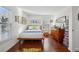 Charming bedroom with wood floors and mid-century modern furniture at 2 Adams St # 1010, Denver, CO 80206