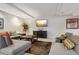 Common area with comfortable seating and TV at 2 Adams St # 1010, Denver, CO 80206