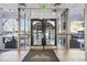 Entrance to Mountain Shadows Condominiums with glass doors at 2 Adams St # 1010, Denver, CO 80206