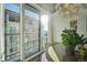 Bright dining area with sliding glass door to balcony and city view at 2 Adams St # 1010, Denver, CO 80206