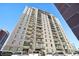 Tall apartment building with numerous balconies and windows at 2 Adams St # 1010, Denver, CO 80206
