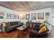 Living room featuring a gray sofa and hardwood floors at 2 Adams St # 1010, Denver, CO 80206