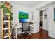 Home office with standing desk, shelving, and view of another room at 2 Adams St # 1010, Denver, CO 80206