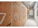Private storage unit with multiple wooden doors at 2 Adams St # 1010, Denver, CO 80206
