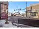 View of a street corner with a bench and traffic signals at 2 Adams St # 1010, Denver, CO 80206