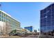 City street view with various buildings at 2 Adams St # 1010, Denver, CO 80206