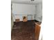 Unfinished basement space with dark flooring, offering potential for customization at 3036 W Clyde Pl, Denver, CO 80211