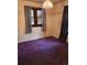 Cozy bedroom featuring purple carpet, a window with curtains, and ample natural light at 3036 W Clyde Pl, Denver, CO 80211