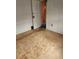 Simple bedroom space with neutral tones, carpet flooring, and a doorway to another room at 3036 W Clyde Pl, Denver, CO 80211