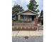 Charming bungalow with brick accents and a cozy, fenced front yard at 3036 W Clyde Pl, Denver, CO 80211