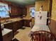 Efficient kitchen with vintage details, including wooden cabinetry and classic appliances at 3036 W Clyde Pl, Denver, CO 80211